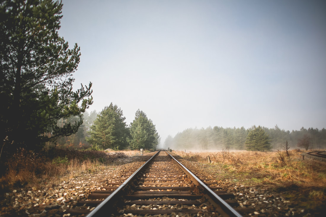 Image of railroad track stretching to the horizon